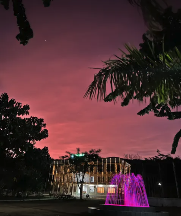 Pink magenta sunset over the hotel